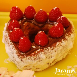 A beautifully crafted Valentine’s Nutella Raspberry Croissant Heart Donut, topped with smooth Nutella spread and decorated with fresh raspberries, dusted with powdered sugar. A luxurious and romantic treat for Valentine’s Day.