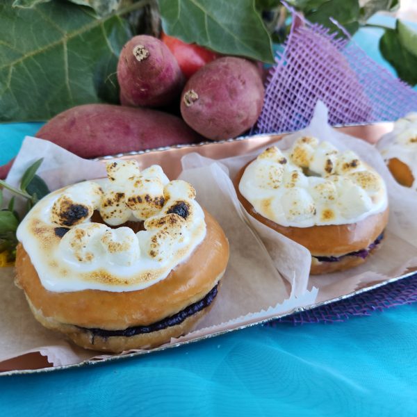 A Thanksgiving donut filled with purple yam jam, topped with marshmallows that are lightly torched for a roasted finish. The donut combines the creamy sweetness of purple yam with the toasty flavor of marshmallows.