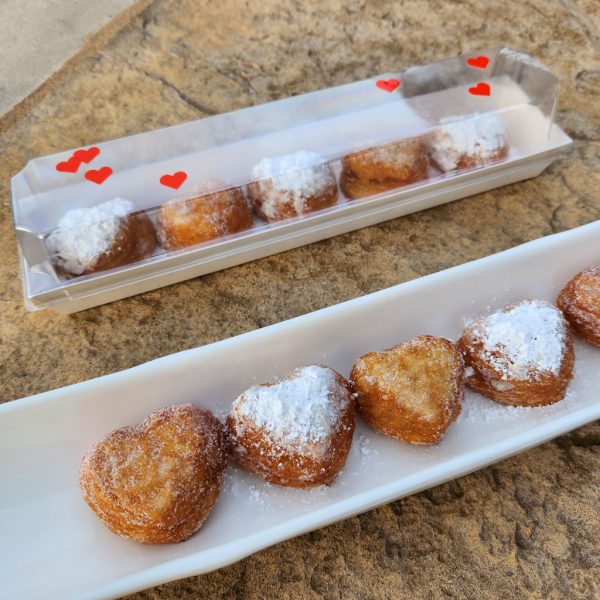 A beautifully packaged Mini Croissant Heart Donut Gift Set with five heart-shaped croissant donuts, filled with strawberry jam and custard cream, lightly dusted with regular or powdered sugar, arranged in a clear plastic mini gift box—a perfect treat for Valentine’s Day and special occasions.